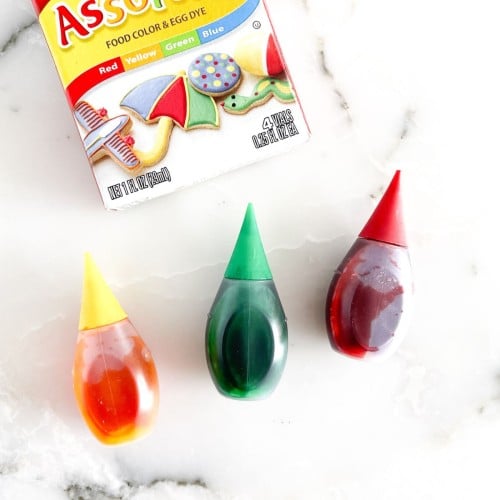 Three bottles of food coloring.